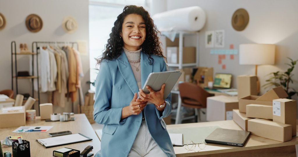 Happy woman, portrait and fashion designer with tablet in logistics or small business management at